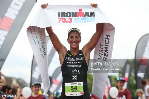 Lisa Huetthaler of Austria celebrates winning the IRONMAN 70.3 Luxembourg-Region Moselle race on June 17, 2018 in Luxembourg, Luxembourg.