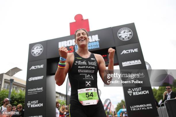 Lisa Huetthaler of Austria celebrates winning the IRONMAN 70.3 Luxembourg-Region Moselle race on June 17, 2018 in Luxembourg, Luxembourg.