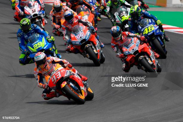 Repsol Honda Team's Spanish rider Marc Marquez leads the pack at the start of the Catalunya Moto GP Grand Prix race at the Catalunya racetrack in...