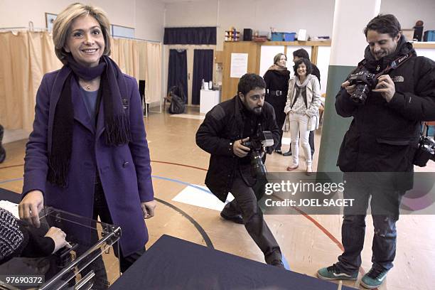 Valerie Pecresse, leading the right-wing UMP party in the Ile-de-France casts her ballot in Versailles on the first round of the regional elections...