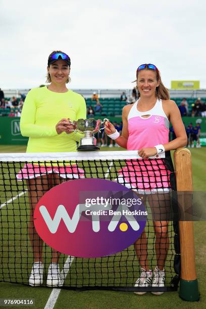 Alicja Rosolska of Poland and Abigail Spears of USA celebrate victory in the Womens Doubles Final during Day Nine of the Nature Valley Open at...