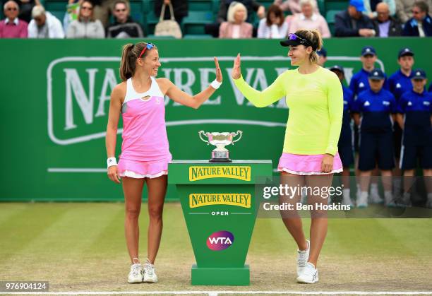 Alicja Rosolska of Poland and Abigail Spears of USA celebrate victory in the Womens Doubles Final during Day Nine of the Nature Valley Open at...