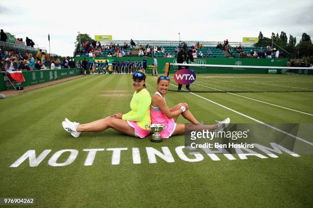 Alicja Rosolska of Poland and Abigail Spears of USA celebrate victory in the Womens Doubles Final during Day Nine of the Nature Valley Open at...