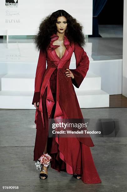 Model wears an outfit from Tina Kalivas during the Opening Night Party for the 2010 L'Oreal Melbourne Fashion Festival at Government House on March...