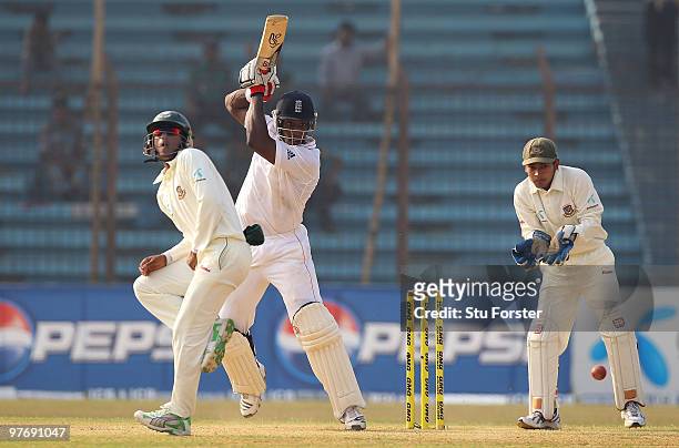 England batsman Michael Carberry cuts a ball to the boundary watched by Bangladesh wicketkeeper Mushfiqur Rahim during day three of the 1st Test...