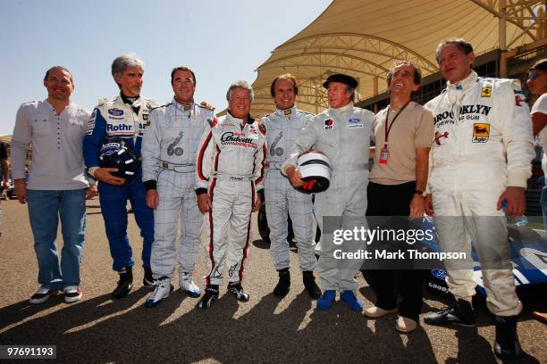 Former F1 World Champions Jacques Villeneuve, Damon Hill, Nigel Mansell, Mario Andretti, Sir Jackie Stewart, Alain Prost and Jody Scheckter pose for...