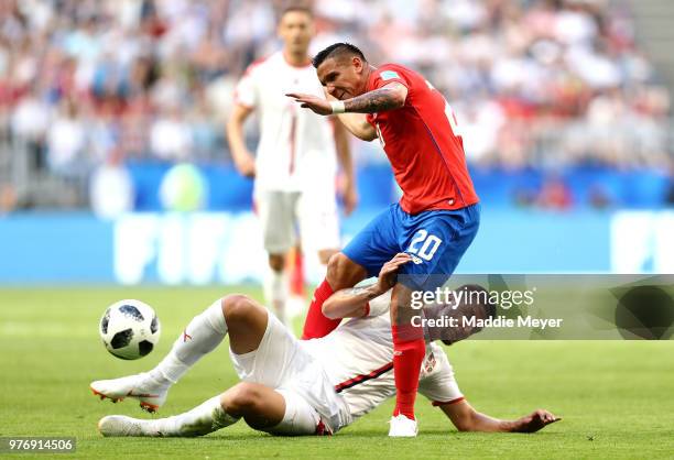 David Guzman of Costa Rica is tackled by Sergej Milinkovic-Savic of Serbia during the 2018 FIFA World Cup Russia group E match between Costa Rica and...