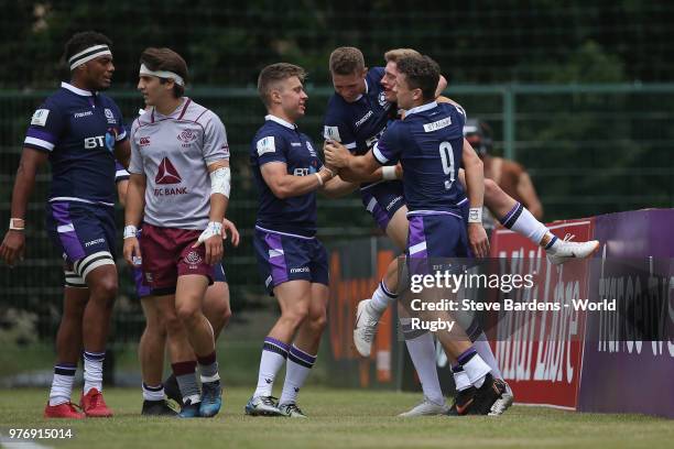 Logan Trotter of Scotland celebrates scoring a try with his team mates during the World Rugby via Getty Images Under 20 Championship 9th Place...