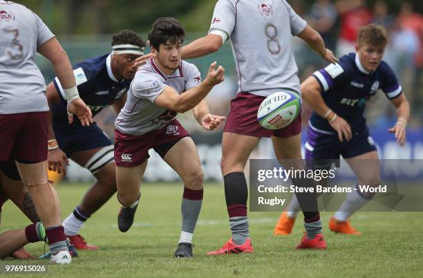 Gela Aprasidze of Georgia passes the ball during the World Rugby via Getty Images Under 20 Championship 9th Place play-off match between Scotland and...