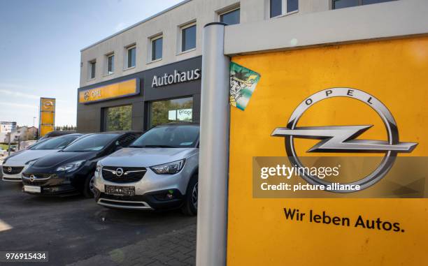 April 2018, Bad Vilbel, Germany: Opel vehicles standing in front of the window display of one of Opel's dealers. The car manufacturer Opel, which is...