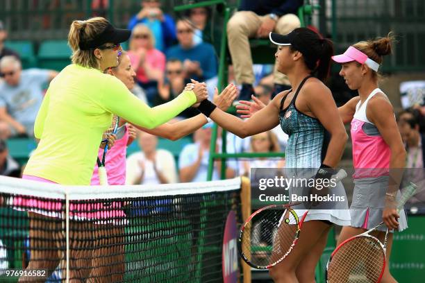 Winners Alicja Rosolska of Poland and Abigail Spears of USA shakes hands with runners up Mihaela Buzarnescu of Romania and Heather Watson of Great...