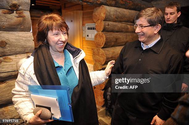 European Union foreign affairs chief Catherine Ashton and Turkish Foreign Minister Ahmet Davutoglu arrive for a press conference during the EU...