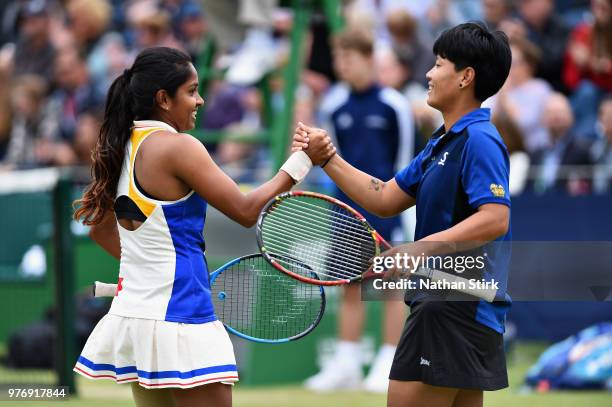 Prarthana Thombare of India and Luksika Kumkhum of Thailand celebrate victory in the Womens Doubles Final during Finals Day of the Fuzion 100...