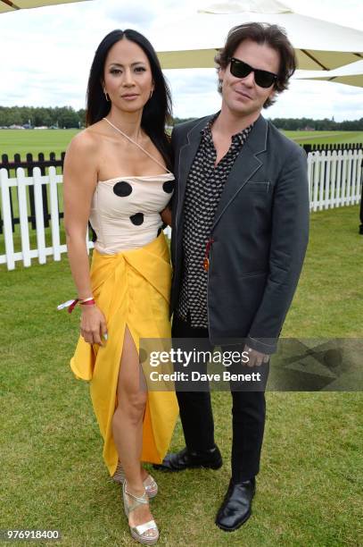 Vicky Lee and Christopher Kane attend the Cartier Queen's Cup Polo Final at Guards Polo Club on June 17, 2018 in Egham, England.