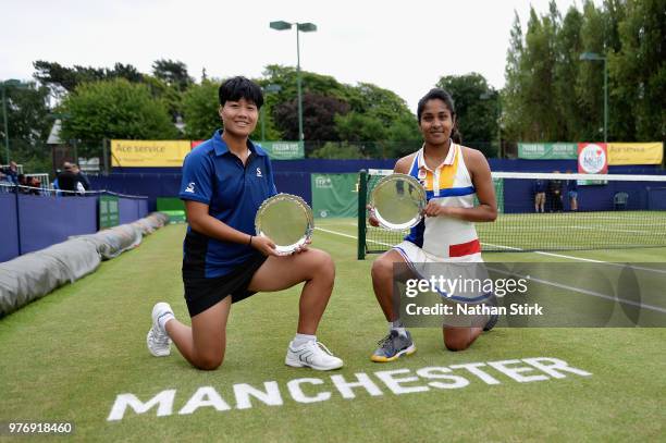 Prarthana Thombare of India and Luksika Kumkhum of Thailand celebrate victory in the Womens Doubles Final during Finals Day of the Fuzion 100...