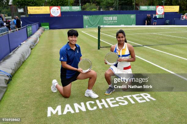 Prarthana Thombare of India and Luksika Kumkhum of Thailand celebrate victory in the Womens Doubles Final during Finals Day of the Fuzion 100...