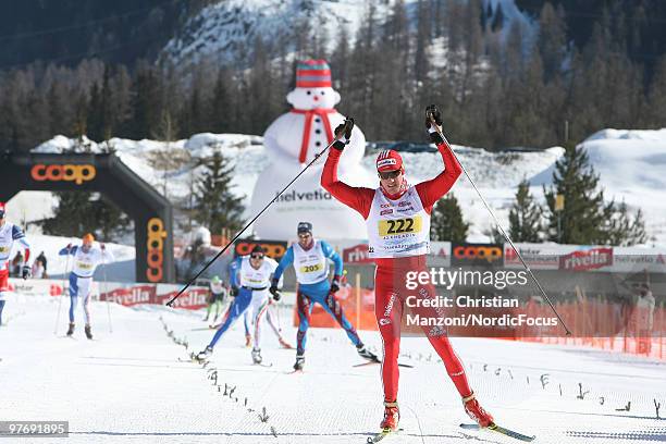 Dario Cologna of Switzerland celebrates his second victory in the FIS Marathon Cup Engadin on March 14, 2010 Scuol, Switzerland.