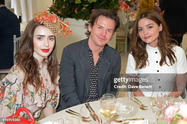 Lily Collins, Christopher Kane and Jenna Coleman attend the Cartier Queen's Cup Polo Final at Guards Polo Club on June 17, 2018 in Egham, England.