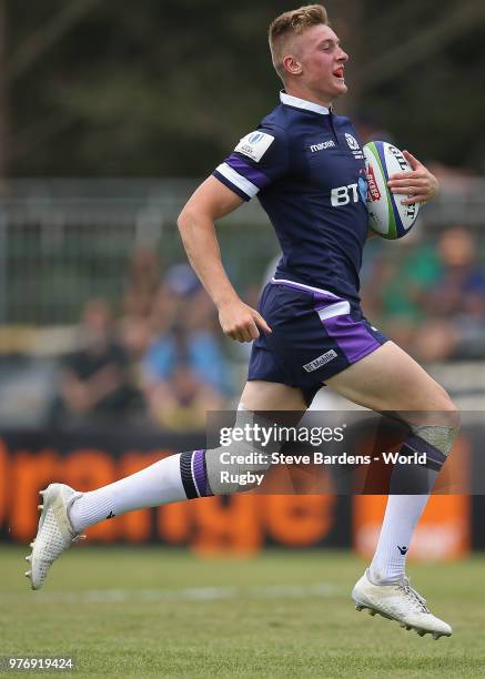 Logan Trotter of Scotland breaks away to score a try during the World Rugby via Getty Images Under 20 Championship 9th Place play-off match between...