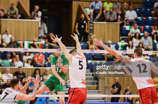 Nikolay Penchev, Bulgaria play the ball against Lucas Van Berkel and Gavin Schmitt, Canada, during Mens Volleyball Nations League, VNL, match between...