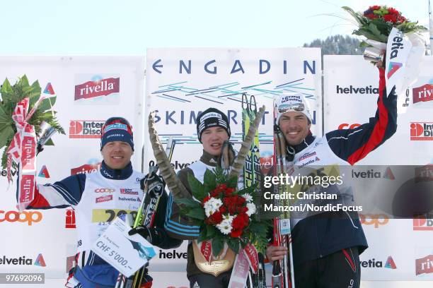 The mens podium celebrate with , Daniel Tynell of Sweden , Dario Cologna of Switzerland and Christophe Perrillat of France during the Flower Ceremony...