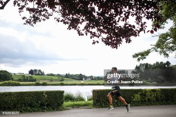 Manuel Kueng of Switzerland competes in the run section of the IRONMAN 70.3 Luxembourg-Region Moselle race on June 17, 2018 in Luxembourg, Luxembourg.