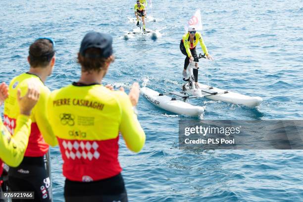 Princess Charlene of Monaco competes during the Riviera Water Bike Challenge 2018 as Pierre Casiraghi applauds on June 17, 2018 in Monaco, Monaco.