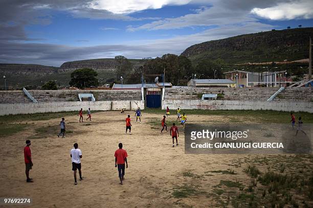 Angolan youths play football in an abandoned stadium in Lubango, Angola on January 22, 2010. Lubango will host one of the four African Cup of Nations...