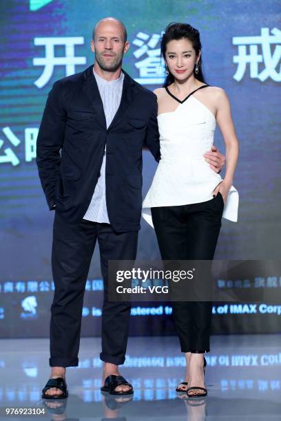 English actor Jason Statham and Chinese actress Li Bingbing attend the press conference of film 'The Meg' during the 21st Shanghai International Film...