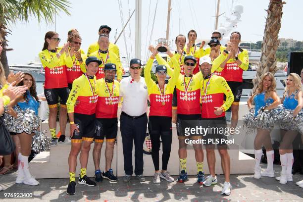 Prince Albert II of Monaco poses with the Winning team David Tanner,Christophe Dominici, Princess Charlene of Monaco, Terence Parkin and Mark Webber...
