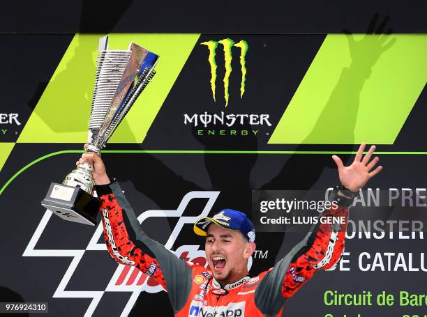 Ducati Team's Spanish rider Jorge Lorenzo celebrates on the podium after winning the Catalunya MotoGP Grand Prix race at the Catalunya racetrack in...