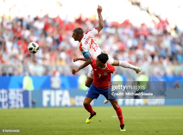 Aleksandar Kolarov of Serbia wins a header over Christian Bolanos of Costa Rica during the 2018 FIFA World Cup Russia group E match between Costa...