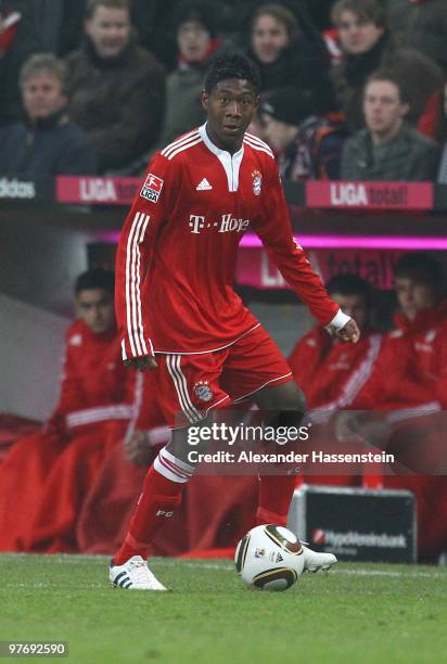 David Alaba of Muenchen runs with the ball during the Bundesliga match between FC Bayern Muenchen and SC Freiburg at Allianz Arena on March 13, 2010...