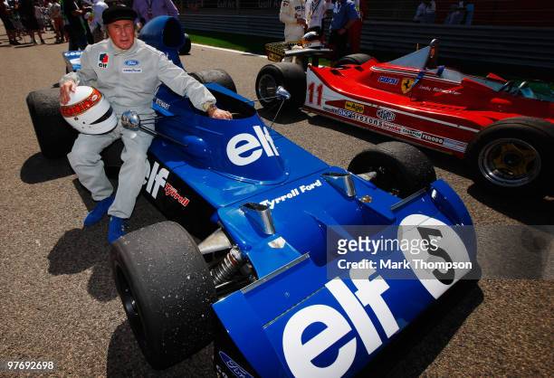 Former F1 World Champion Sir Jackie Stewart is seen with his Tyrrell Ford during celebrations of the 60th Anniversary of the F1 World Championship...