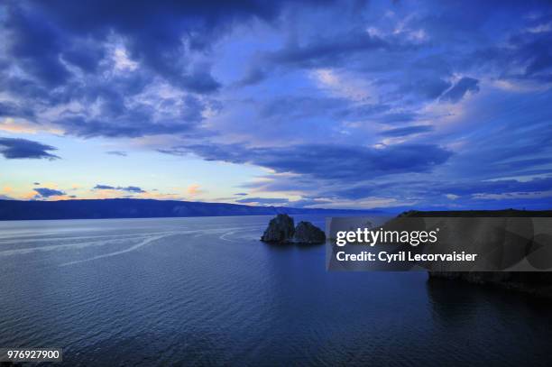 shaman rock in sunset, in olkhon island, russia - olkhon island stock pictures, royalty-free photos & images