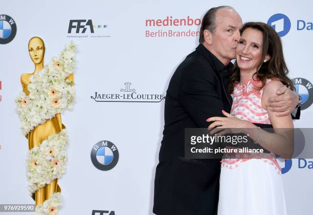 April 2018, Germany, Berlin: Actor Herbert Knaup with his wife Christiane Knaup arriving at the 68th award ceremony of the German film prize 'Lola'....
