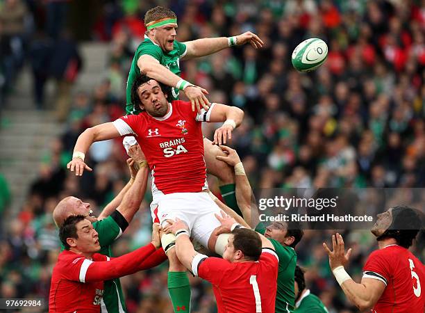 Jamie Heaslip of Ireland beats Jonathan Thomas of Wales to a lineout ball during the RBS Six Nations match between Ireland and Wales at Croke Park...