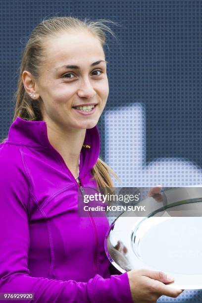 Aleksandra Krunic of Serbia holds the trophy after winning the women's singles final match against Kirsten Flipkens of Belgium at the Libema Open...