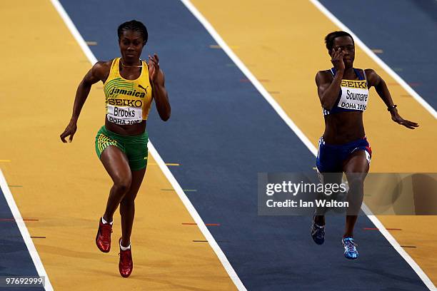 Sheri-Ann Brooks of Jamaica and Myriam Soumare of France competes in the Womens 60m Semi Final during Day 3 of the IAAF World Indoor Championships at...