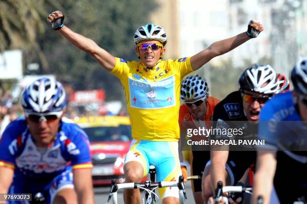Kazahkstan's Astana cycling team's Spain's Alberto Contador celebrates after winning on March 14, 2010 the 2010 Paris-Nice cycling race run around...