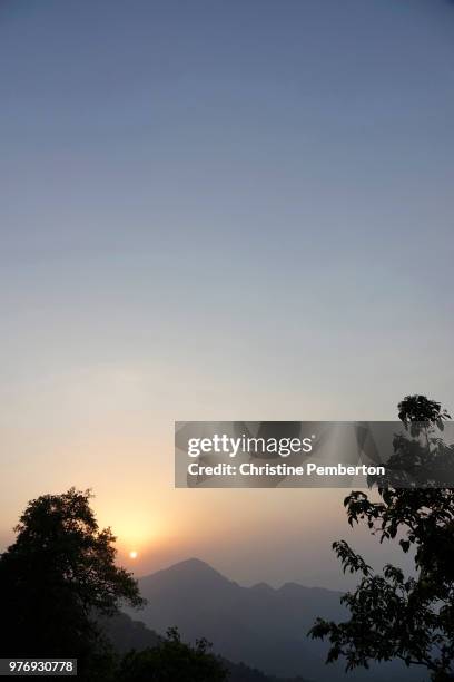 sunset over the mountains in mussoorie, a hill station in northern india. - mussoorie stock pictures, royalty-free photos & images