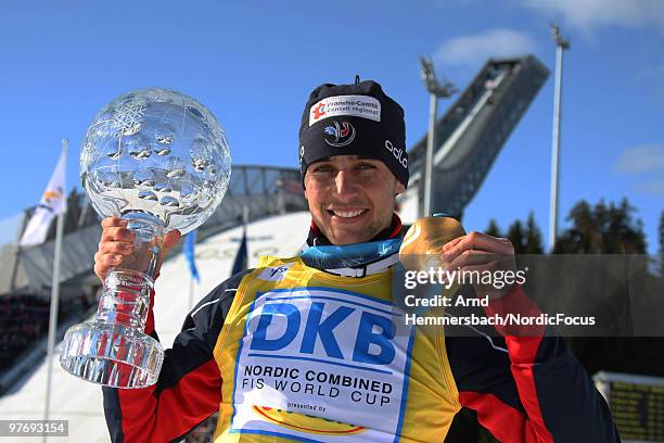 Jason Lamy-Chappuis of France celebrates his overall world cup victory after the last race of the season in the Gundersen Ski Jumping HS 134/10km...