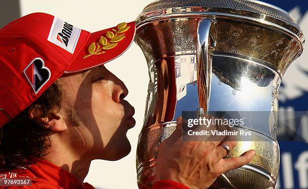 Fernando Alonso of Spain and Ferrari celebrates on the podium after winning the Bahrain Formula One Grand Prix at the Bahrain International Circuit...