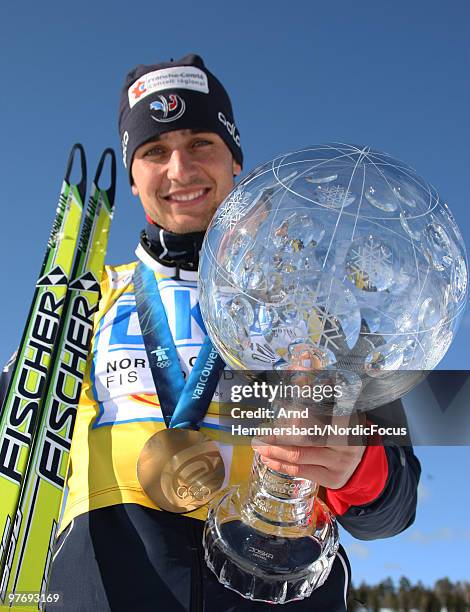 Jason Lamy-Chappuis of France celebrates his overall world cup victory after the last race of the season in the Gundersen Ski Jumping HS 134/10km...