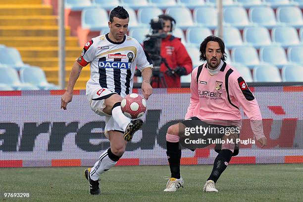 Antonio Di Natale of Udinese kicks the ball as Mattia Cassani of Palermo looks on during the Serie A match between Udinese Calcio and US Citta di...