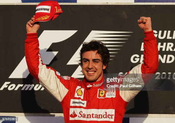 Fernando Alonso of Spain and Ferrari celebrates on the podium after winning the Bahrain Formula One Grand Prix at the Bahrain International Circuit...