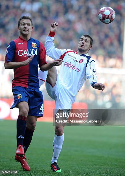 Domenico Criscito of Genoa CFC battles for the ball against Daniele Dessena of Cagliari Calcio during the Serie A match between Genoa CFC and...