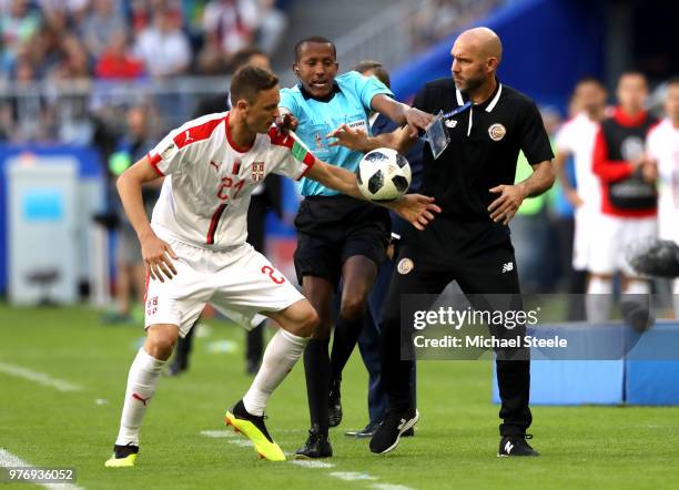 Nemanja Matic of Serbia tries to get the ball from a Costa Rica official as fourth official tries to step in during the 2018 FIFA World Cup Russia...