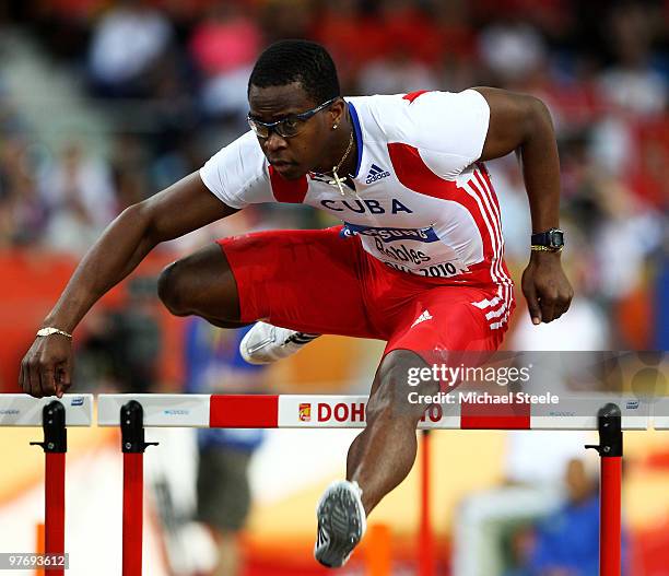 Dayron Robles of Cuba competes in the Mens 60m Hurdles during Day 3 of the IAAF World Indoor Championships at the Aspire Dome on March 14, 2010 in...