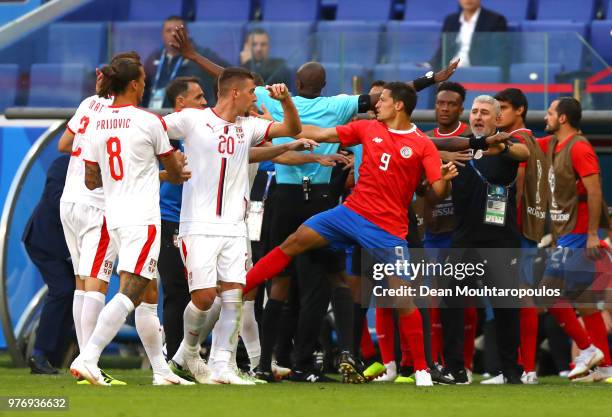 Tempers flare between Serbia and Costa Rica players as fourth official tries to step in after Nemanja Matic of Serbia clashes with Celso Borges of...